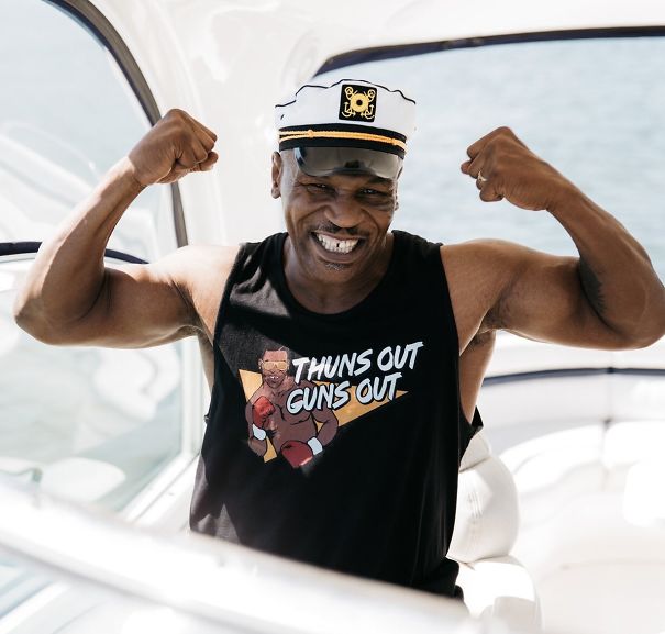 Mike Tyson On A Yacht Wearing A Thuns Out Guns Out Shirt