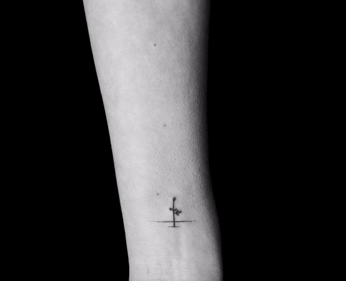 Minimalist tattoo on forearm, part of a motion tattoo series linking frames inked on different strangers. Minimalist tattoo on forearm, part of a motion tattoo series linking frames inked on different strangers.