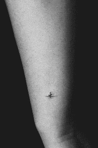 Forearm with a small tattoo, part of a series creating a motion tattoo across multiple individuals.