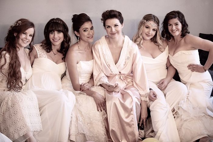 Couple Has An "Unusual" Wedding Where Guests Get To Wear Their Old Bridal Dresses Again