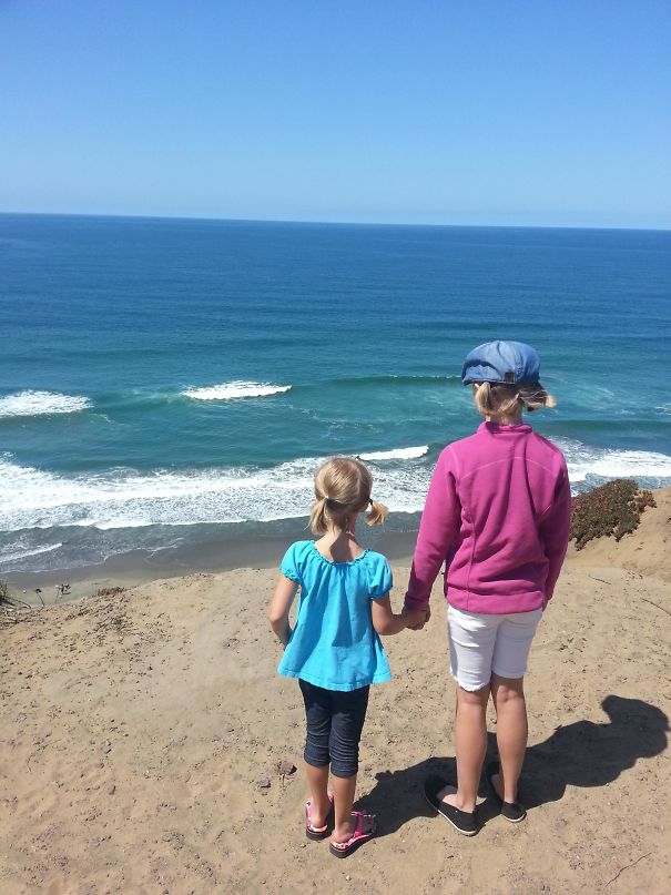 My Kids On A Cliff Looking At The Ocean Makes Them Look Like Giants