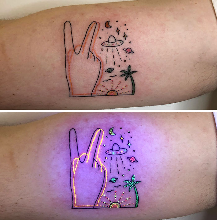 UV tattoo design showing hand gesture, outer space, and tropical elements, glowing under blacklight.