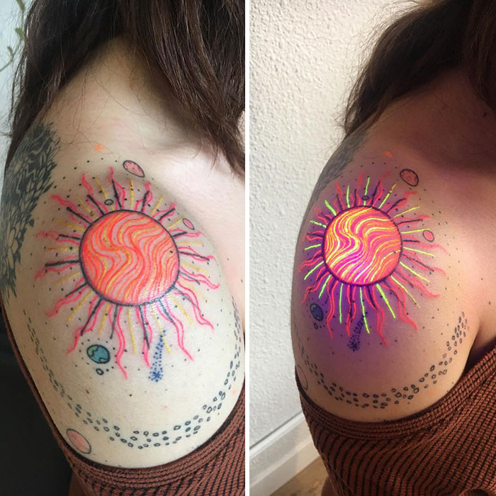 UV tattoo design of a vibrant sun on a shoulder, glowing under blacklight.