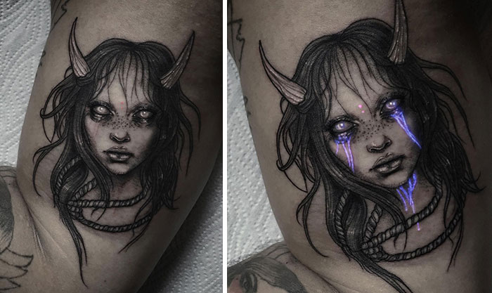 UV tattoo design featuring a mysterious face with horns and glowing eyes, showing a contrast under blacklight.