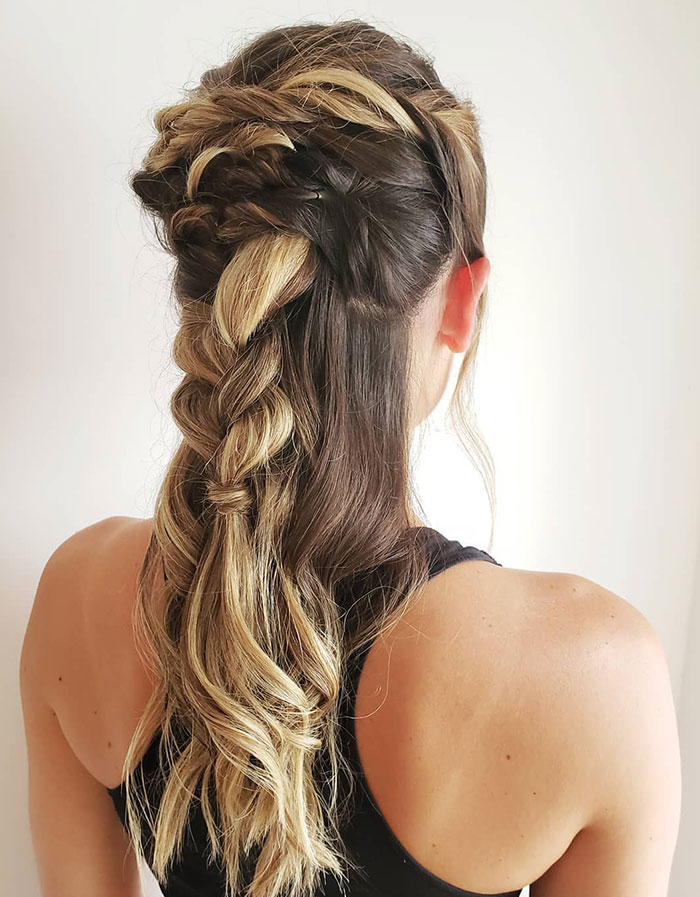 Woman with fierce Viking hairstyle, featuring a braided and flowing design, perfect for modern day Valkyries.