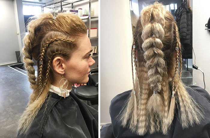Woman with Viking hairstyle featuring braided elements, viewed from side and back in a salon setting.