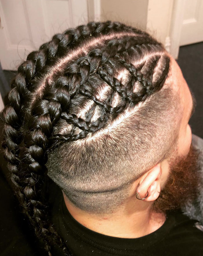 Braided Viking hairstyle with shaved sides, perfect for modern Valkyries.