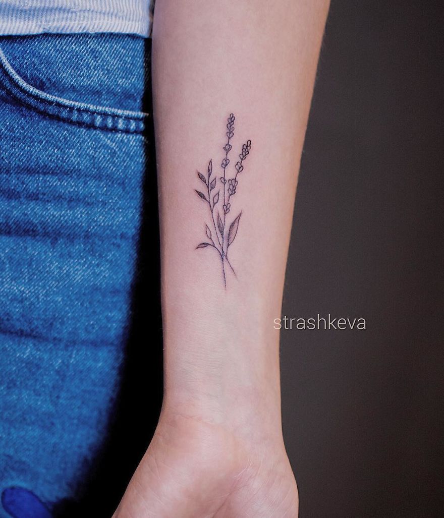 Delicate floral tattoo by Lublin artist on a person's forearm, showcasing fine line work and subtle details.