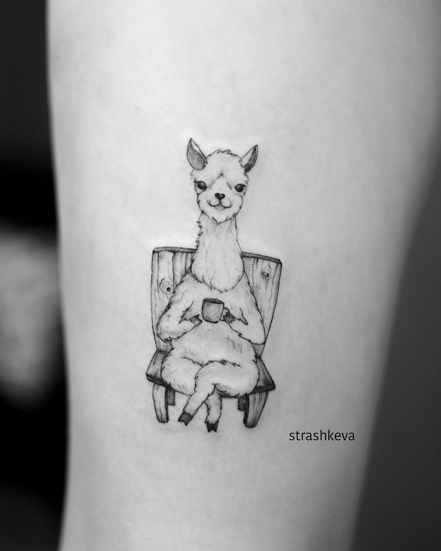 Tattoo of an alpaca sitting with a cup, created by a talented Lublin tattoo artist in Poland.