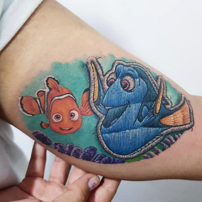 Embroidery tattoo of fish characters, showcasing the Brazilian artist's unique tattoo style.