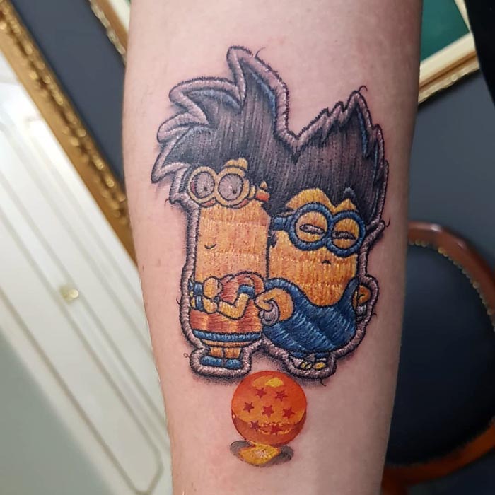 Embroidery tattoo of cartoon characters on arm, a unique design by Brazilian tattoo artist.