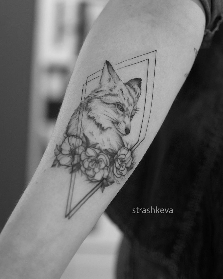 Tattoo of a fox with flowers on an arm by a female artist in Lublin, Poland.