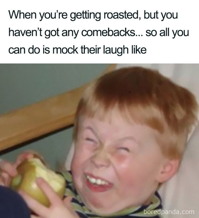 Child laughing with a scrunched face, holding an apple, illustrating a humorous sibling meme moment.