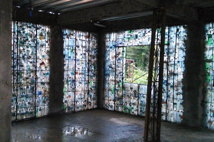 Man Builds Homes Out Of Plastic Bottles And They Look Just Like Regular Houses