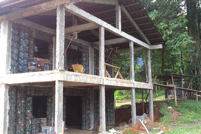Man Builds Homes Out Of Plastic Bottles And They Look Just Like Regular Houses