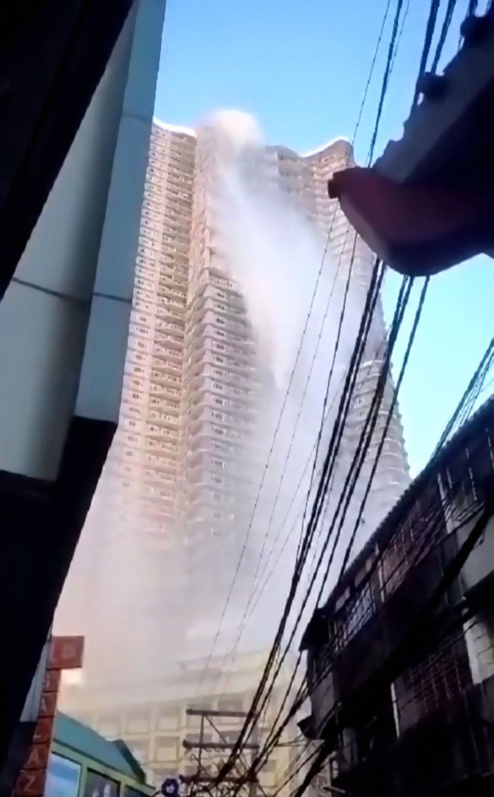 Water Cascades Down From The Rooftop Of A Skyscraper As A 6.1 Magnitude Earthquake Hits Manila
