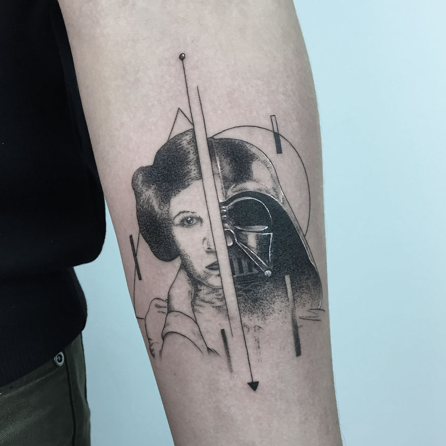 Geometric tattoo design on arm featuring half faces, combining elements with geometric shapes.