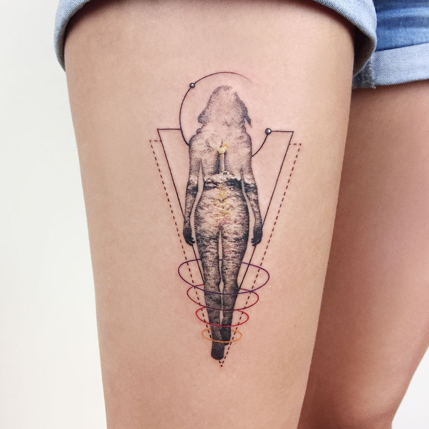 Geometric tattoo design on thigh featuring abstract human figure and lines.