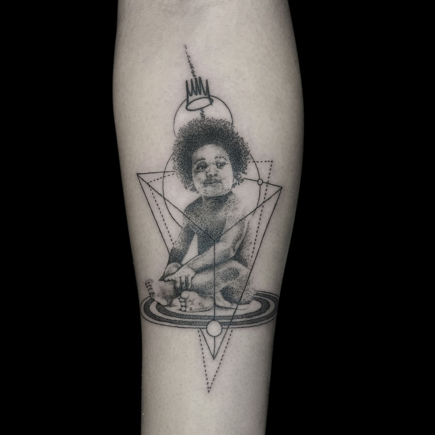 Geometric tattoo design of a child seated within complex shapes, symbolizing life's events and milestones.