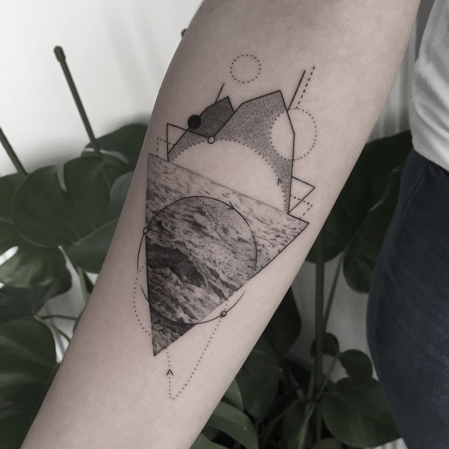 Geometric tattoo design on forearm, featuring shapes and textures, symbolizing life events.