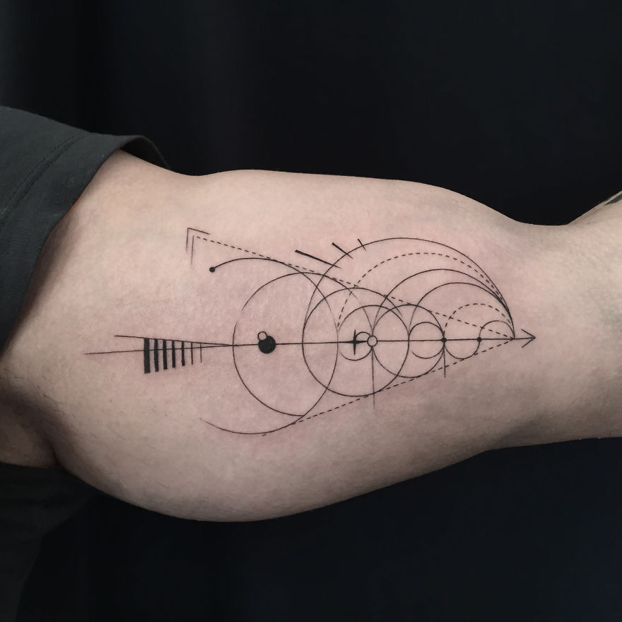 Geometric tattoo design featuring interconnected circles and lines on an arm, symbolizing life events.