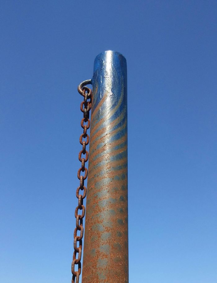 The Wear Marks On This Tetherball Pole