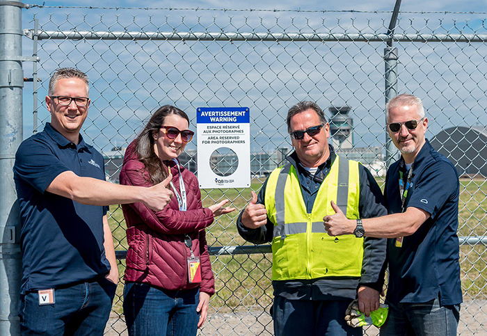 To Help Planespotting Photographers Get Shots, This Airport In Canada Had Holes Cut Out In Their Fence