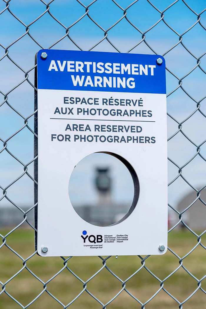 To Help Planespotting Photographers Get Shots, This Airport In Canada Had Holes Cut Out In Their Fence