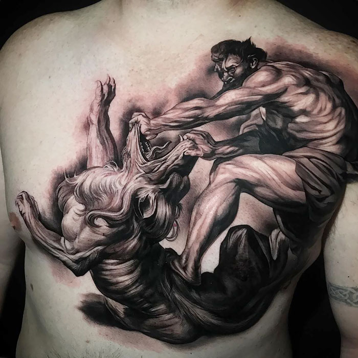 Detailed chest tattoo of a mythological scene, showcasing intricate ink design ideas.