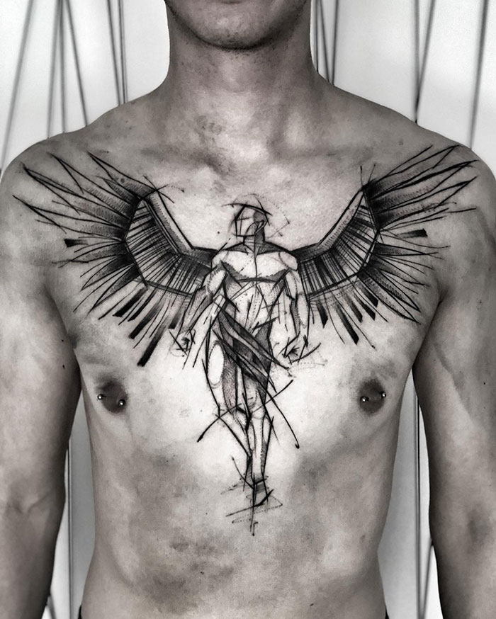 Abstract angel-themed chest tattoo showcasing incredible ink design.