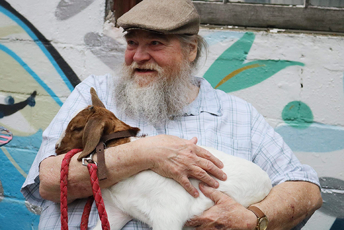 Son Shares Heartwarming Pictures Of His Dad Holding A 3 Weeks Old Baby Goat, And It's Priceless Son Shares Heartwarming Pictures Of His Dad Holding A 3 Weeks Old Baby Goat, And It's Priceless