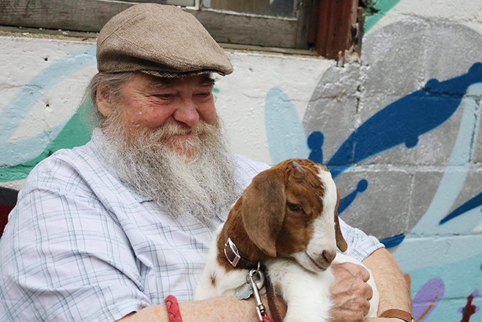 Son Shares Heartwarming Pictures Of His Dad Holding A 3 Weeks Old Baby Goat, And It's Priceless Son Shares Heartwarming Pictures Of His Dad Holding A 3 Weeks Old Baby Goat, And It's Priceless