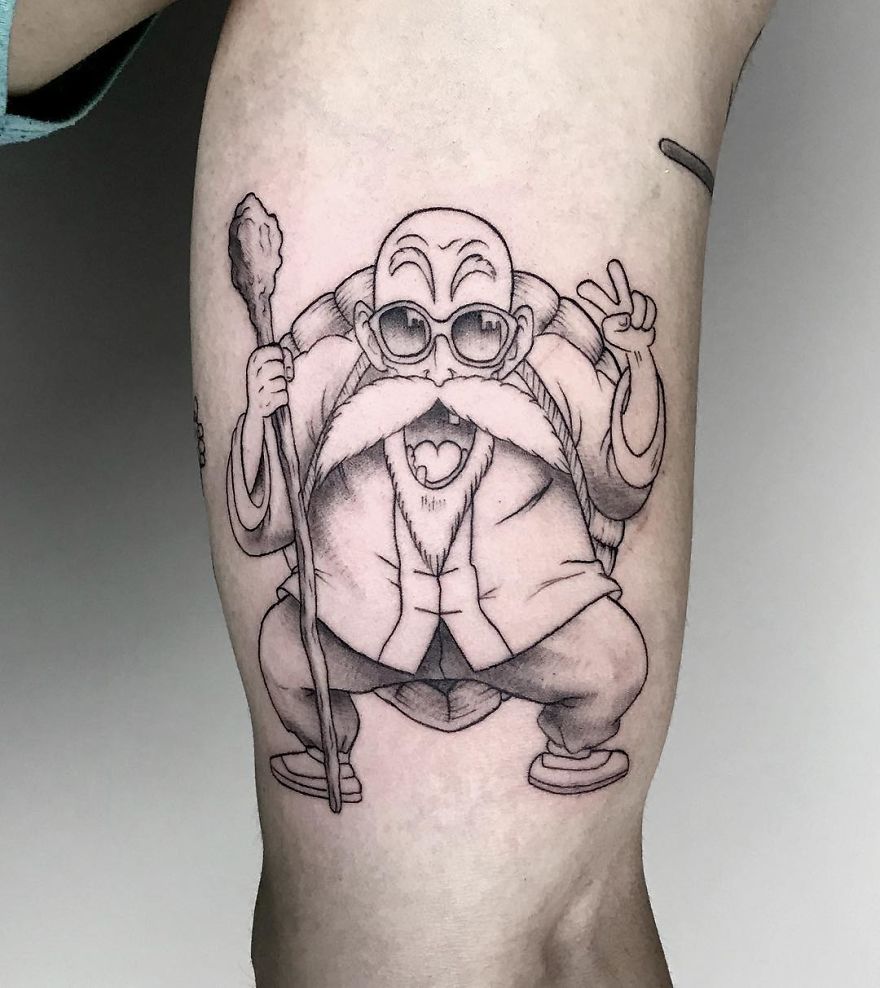 Dragon Ball tattoo featuring a detailed design of a character Master Roshi with glasses and a peace sign.