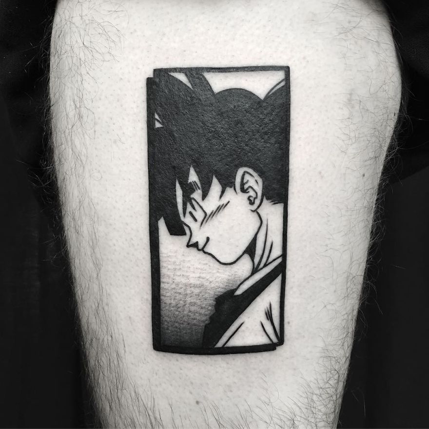 Black and white Dragon Ball tattoo featuring a character Goku profile on a person’s arm.