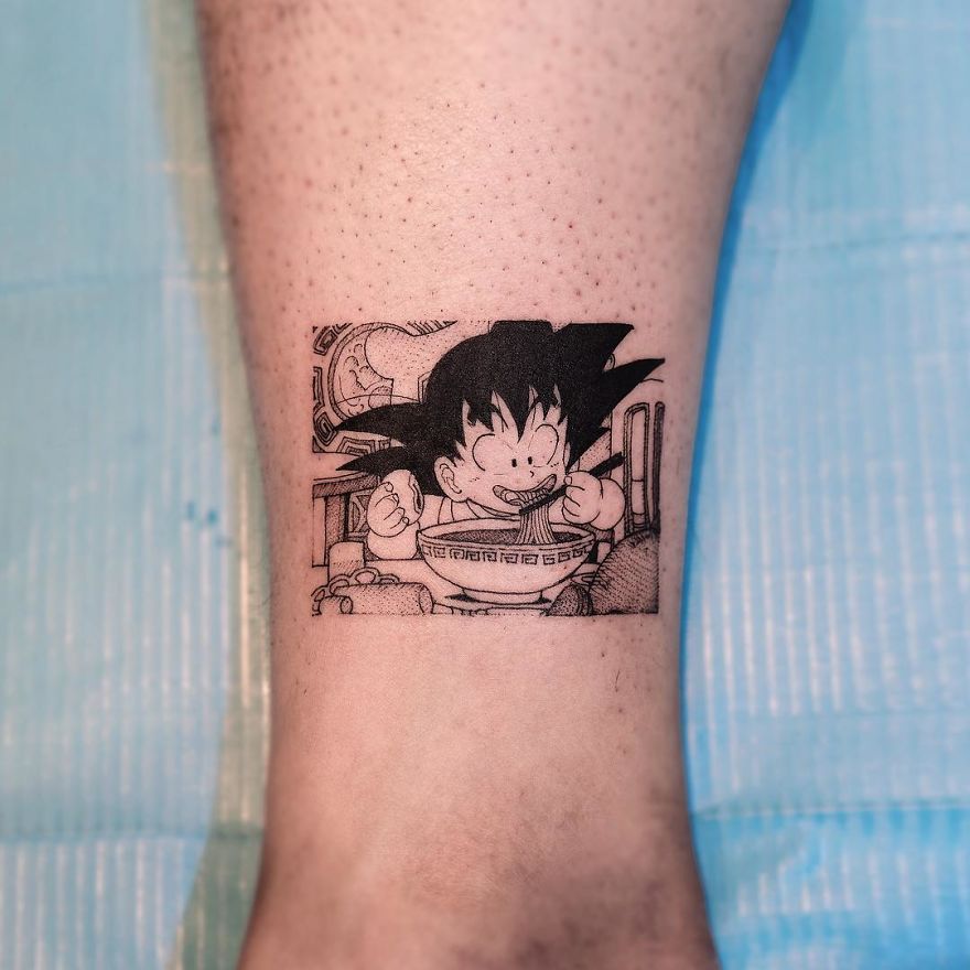 Dragon Ball tattoo featuring young Goku enjoying noodles, inked on calf.