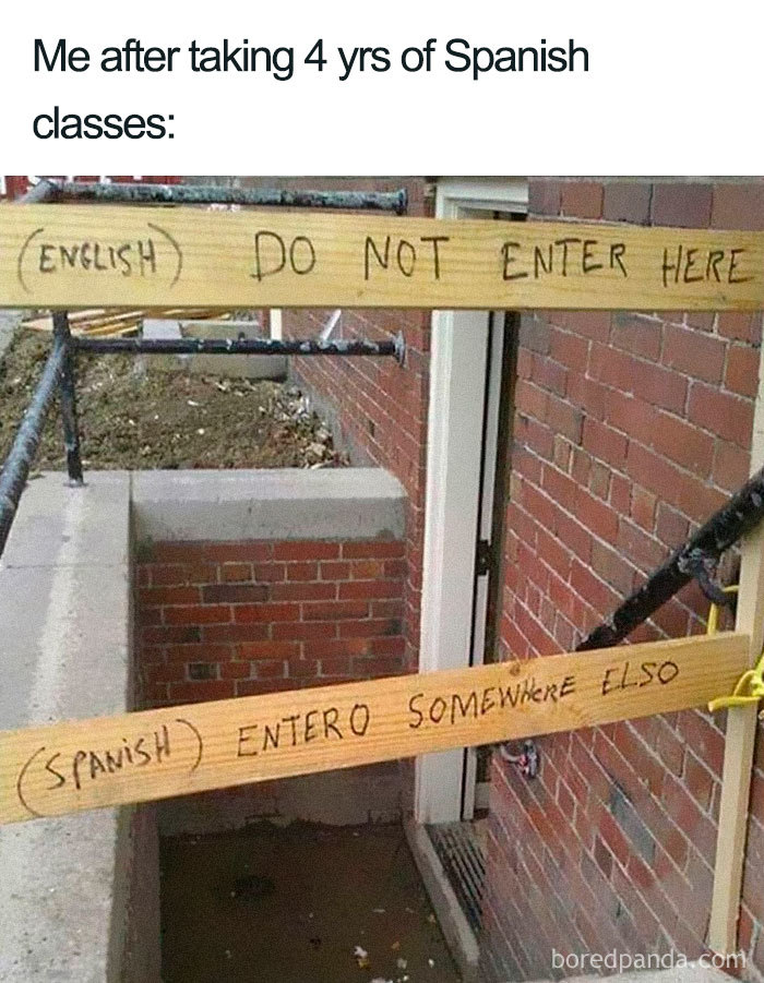 Meme about Spanish language confusion shows humorous translation errors on wooden barriers.