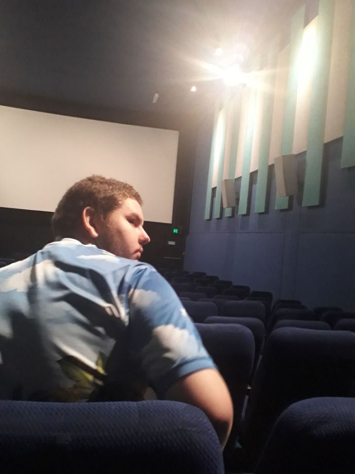 An Otherwise Empty Cinema And He Sits Directly Infront Of Me