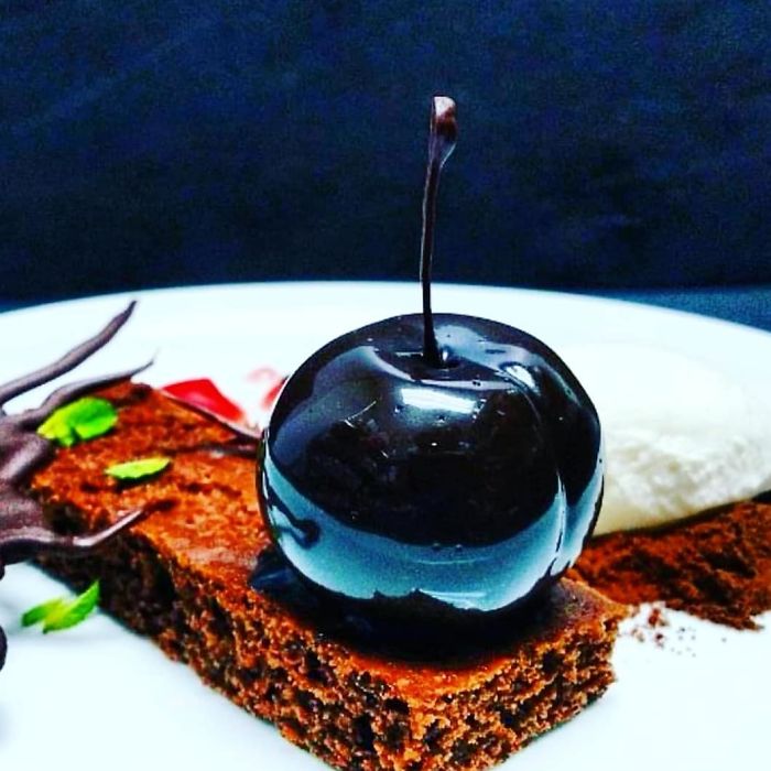 Chocolate Cherry Ganache,mirror Glazed And Served With Chocolate Sponge, Cream And A Cherry Gel