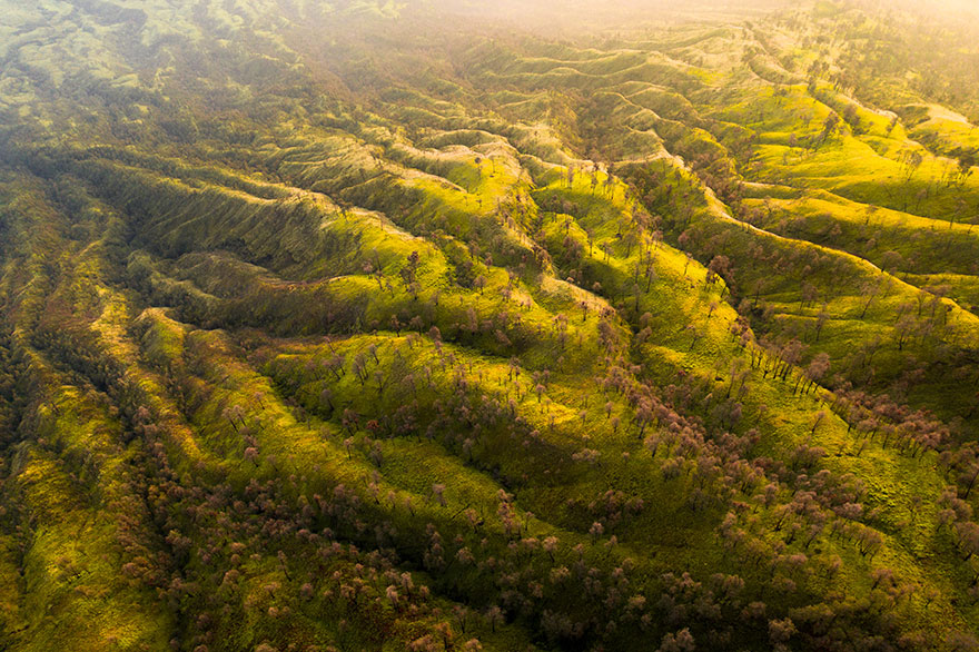 The Valleys Of Ijen Volcano Lit By The Rising Sun