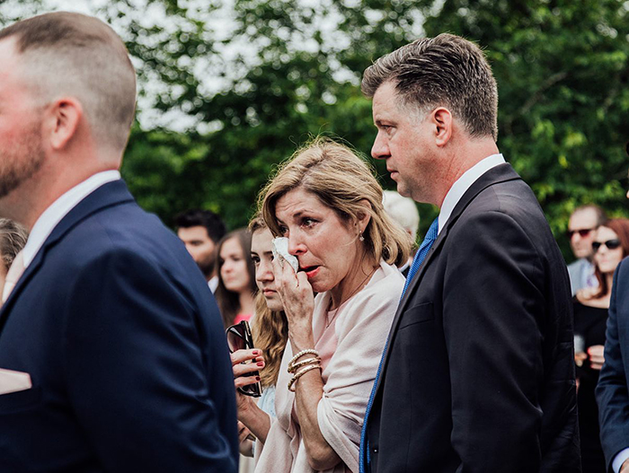 Guests emotional at wedding as groom's family releases butterflies to honor his late sister during ceremony outdoors Guests emotional at wedding as groom's family releases butterflies to honor his late sister during ceremony outdoors
