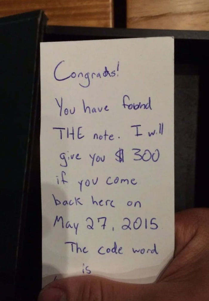 Handwritten note tucked in second-hand books promising $300 and a May 27, 2015 meeting.