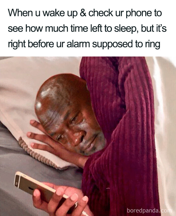 Crying face photoshopped onto a person looking at a phone, illustrating a funny sleeping meme.