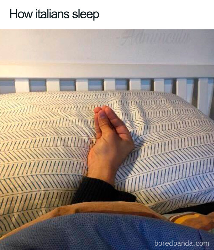 Hand making a typical Italian gesture while lying in bed, a humorous sleeping meme from the funniest sleeping memes collection.