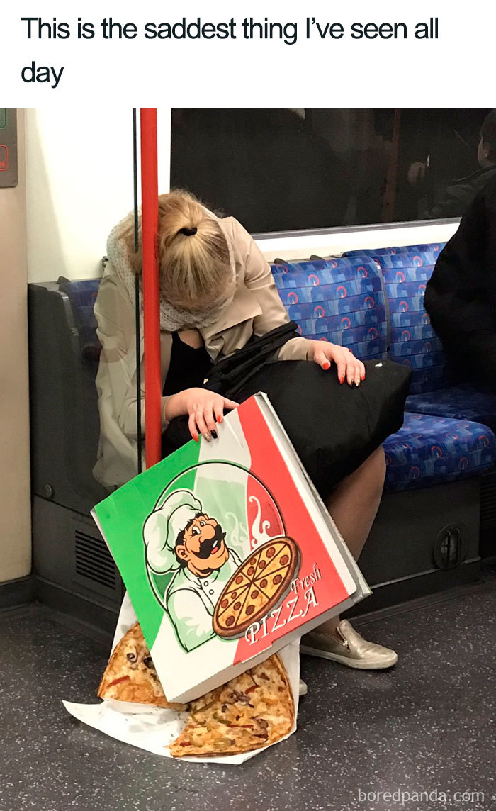 Sleeping person on train with fallen pizza box, a funny sleeping meme.