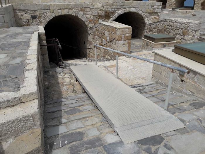 Wheelchair Ramp Ends In Metal Chain And Medival Staircase