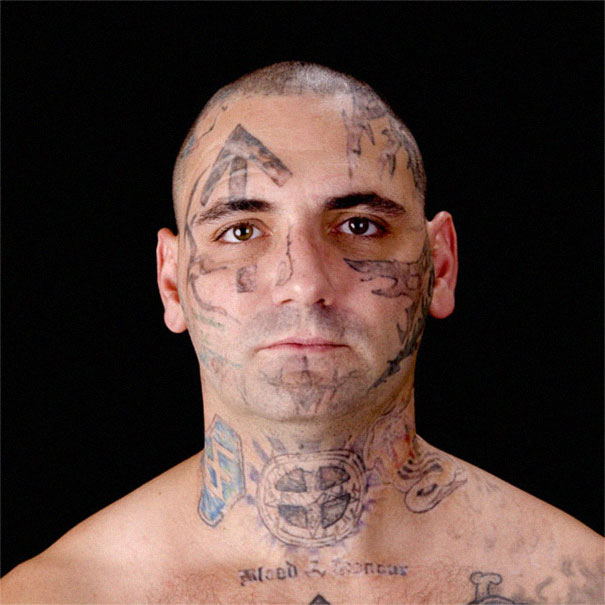 Ex-skinhead with tattoos on face and neck, deciding to remove racist tattoos after fatherhood realization. Ex-skinhead with tattoos on face and neck, deciding to remove racist tattoos after fatherhood realization.