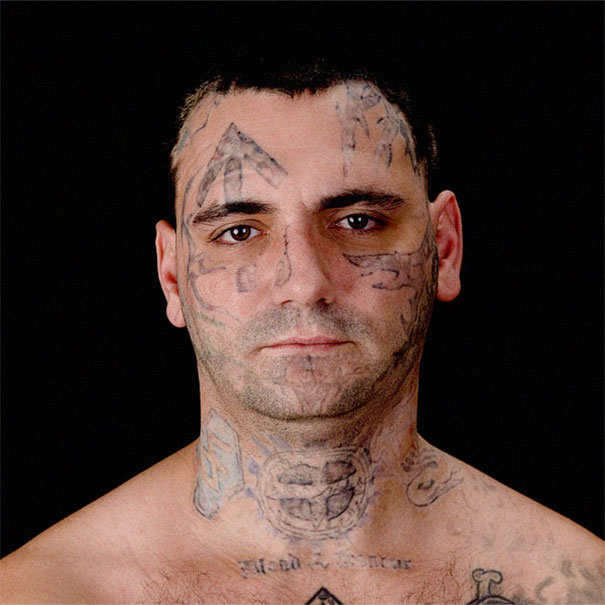 Man with faded tattoos symbolizing skinhead past, focusing on removal after fatherhood transformation. Man with faded tattoos symbolizing skinhead past, focusing on removal after fatherhood transformation.