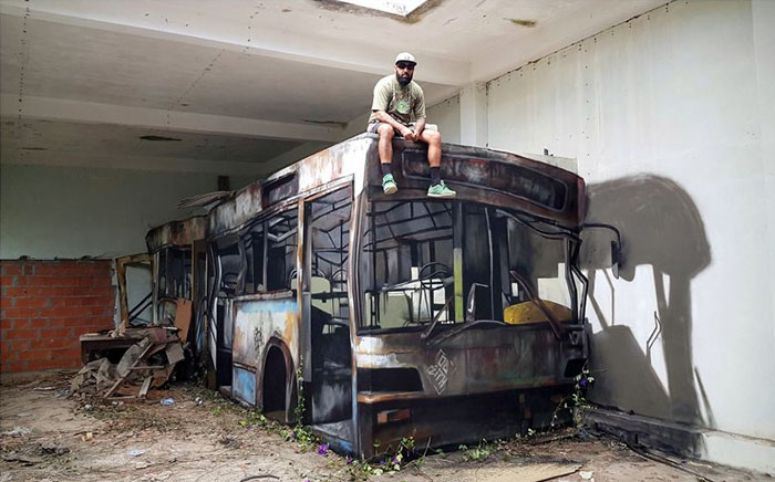 Portuguese Graffiti Artist Turns A Concrete Block Into An Abandoned Bus Portuguese Graffiti Artist Turns A Concrete Block Into An Abandoned Bus
