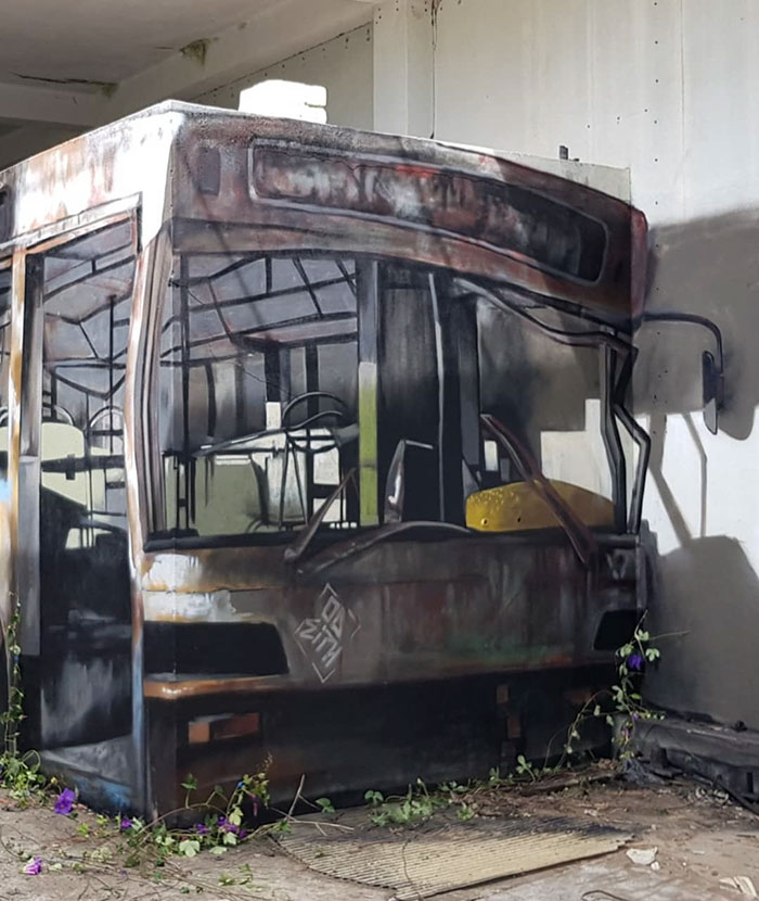 Portuguese Graffiti Artist Turns A Concrete Block Into An Abandoned Bus Portuguese Graffiti Artist Turns A Concrete Block Into An Abandoned Bus