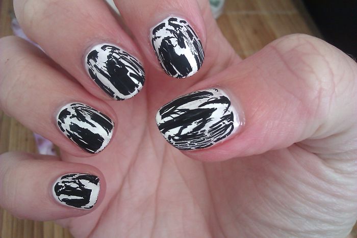 Black and white c*****d nail art design showcasing one of the hottest trends from the past decade forgotten by many.